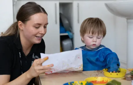Staff providing learning experiences for nursery children